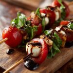 Close-up of Caprese Skewers with Balsamic Glaze, featuring cherry tomatoes, mozzarella balls, and basil leaves on wooden skewers.