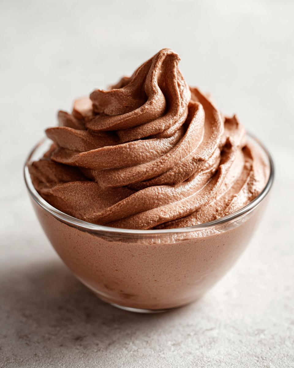 A bowl of creamy chocolate soft serve made from frozen bananas, a guilt-free treat.