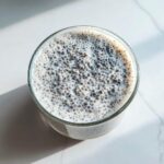 Overhead view of Vanilla Bean Chia Pudding showing the texture of soaked chia seeds in creamy liquid.