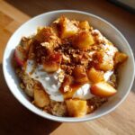 A close-up of the Apple Pie Breakfast Bowl 2, featuring oatmeal, yogurt, cinnamon apples, and granola.