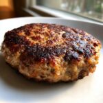 Close-up of a juicy, perfectly seared patty, highlighting the crust of one of the Best Turkey Burgers.