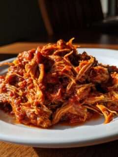 A close-up of shredded beef in rich tomato sauce, perfect for Slow Cooker Beef Ragu Whole30 Paleo.